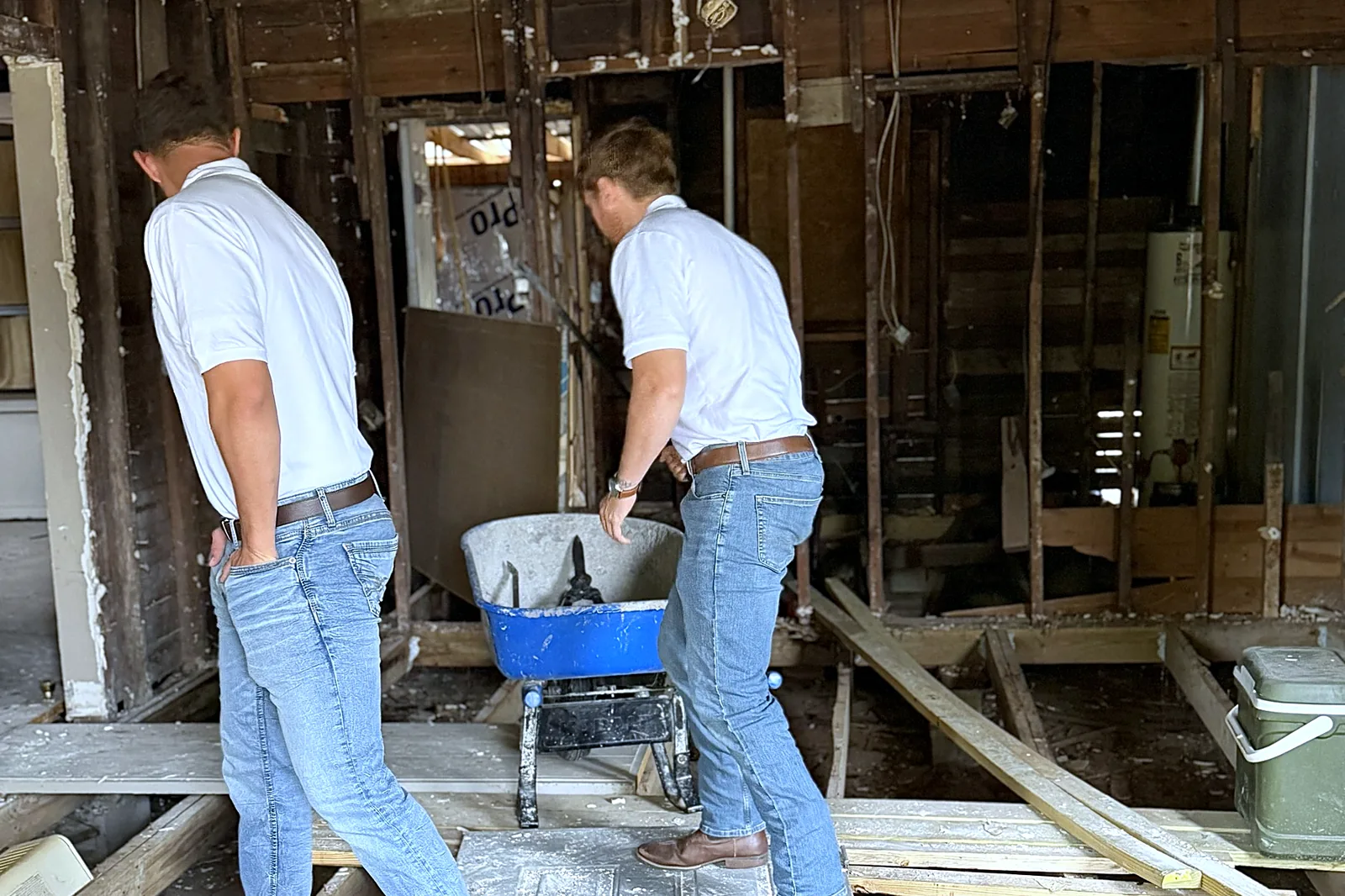 Marco and Kaleb inside the house on South 28th Street, stripped back to the studs